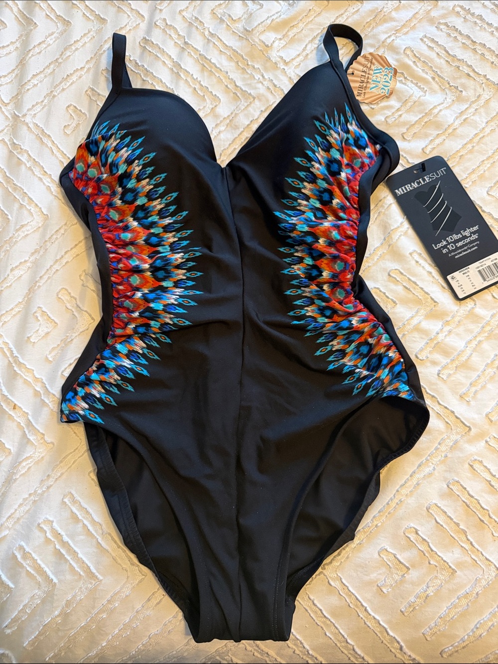 Miraclesuit Black One-Piece Swimsuit with Red, Blue and Teal Feather Motif
